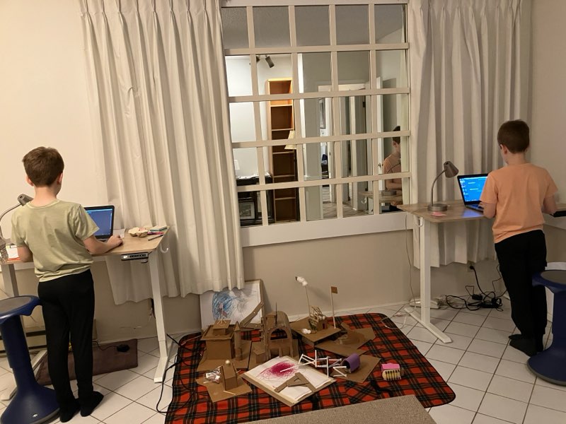 Kids battling on laptops